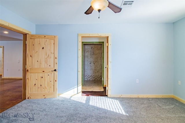 unfurnished bedroom with visible vents, a ceiling fan, baseboards, and carpet floors