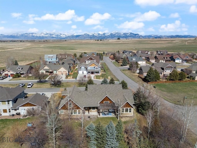 birds eye view of property featuring a mountain view