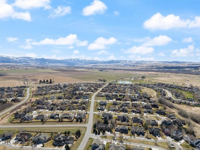 birds eye view of property featuring a mountain view