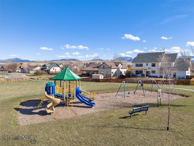 view of play area featuring a mountain view and a lawn