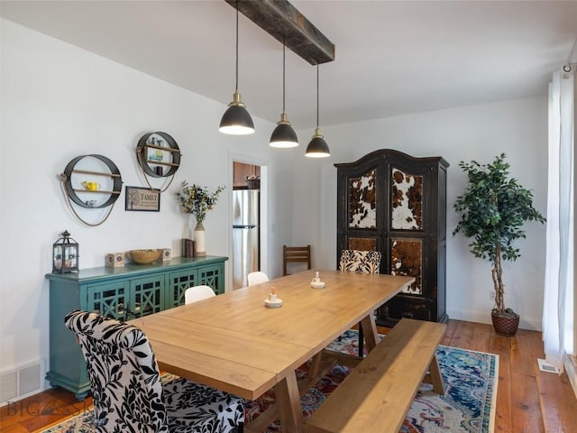 dining area with wood-type flooring