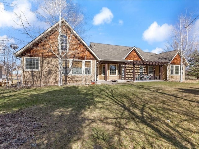 view of front of house with a front lawn and a patio