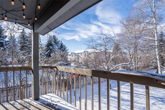 view of snow covered deck