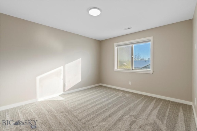 unfurnished room featuring carpet flooring