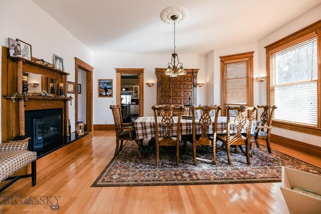 dining space featuring an inviting chandelier and hardwood / wood-style floors