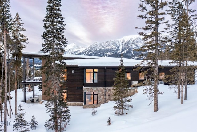 view of snowy exterior featuring a mountain view