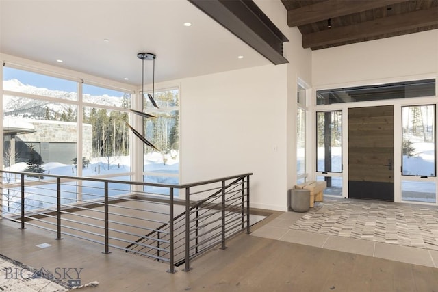 interior space featuring hardwood / wood-style flooring and beam ceiling