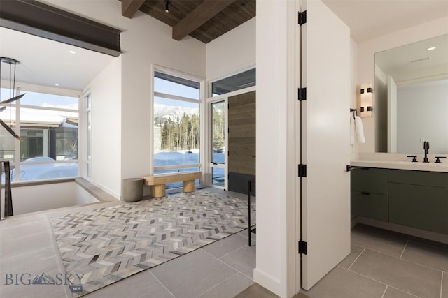 bathroom with vanity, tile patterned floors, wooden ceiling, and beamed ceiling