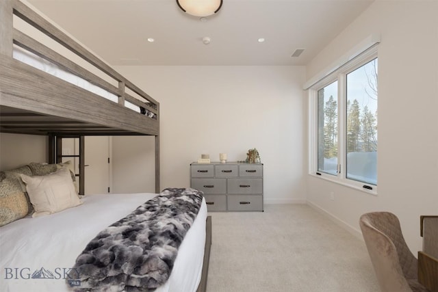 bedroom featuring light colored carpet