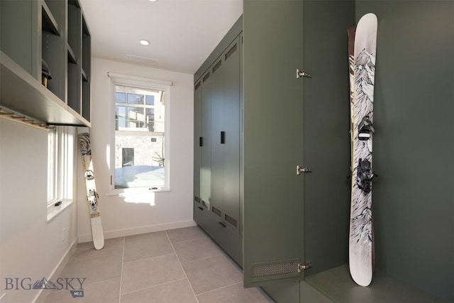 doorway to outside featuring light tile patterned floors