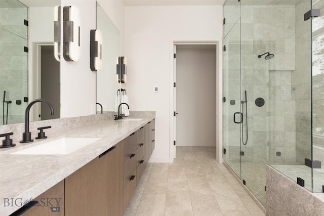 bathroom with walk in shower, vanity, and tile patterned flooring