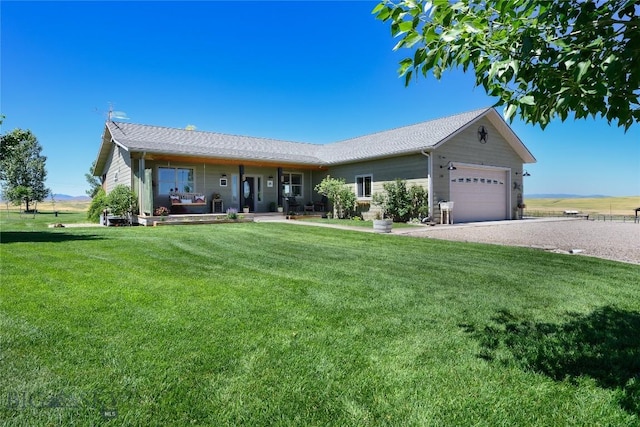 ranch-style home with a garage and a front yard