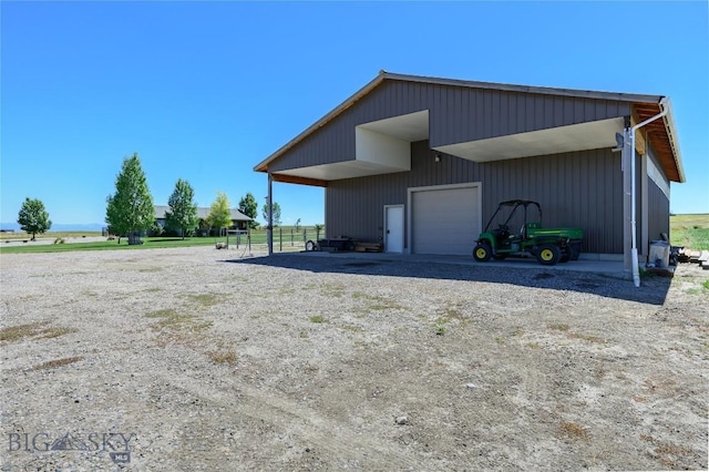 view of side of property with a garage