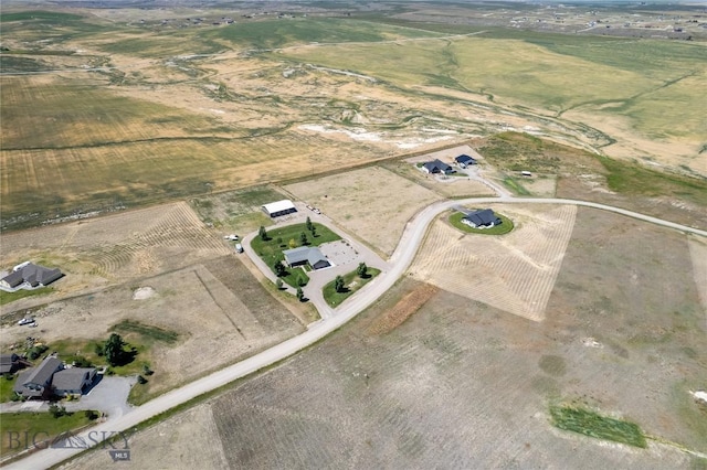 birds eye view of property featuring a rural view