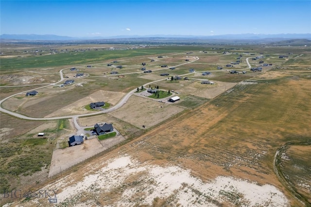 birds eye view of property featuring a mountain view and a rural view