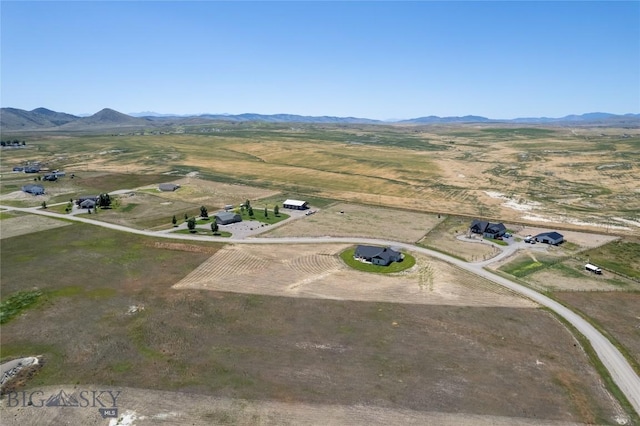 drone / aerial view with a rural view and a mountain view