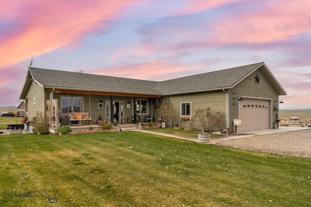 ranch-style house with a porch, a garage, and a lawn