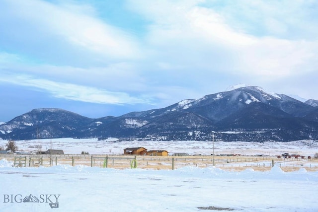 mountain view featuring a rural view