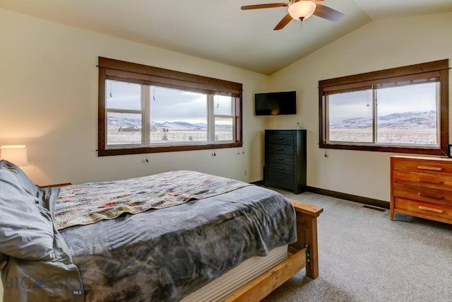 bedroom with lofted ceiling, light carpet, and ceiling fan