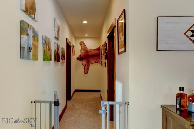 hall with light colored carpet