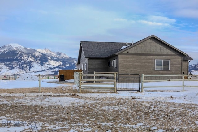 view of snow covered exterior with a mountain view