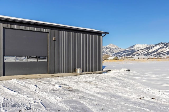 snow covered property with a mountain view