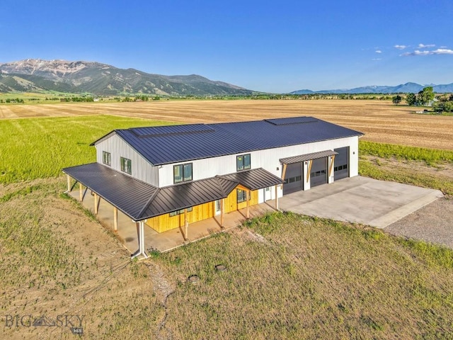 6111 Springhill Rd, Belgrade, MT 59714 - view of front of property featuring a mountain view, metal roof, a standing seam roof, driveway, and a view of countryside