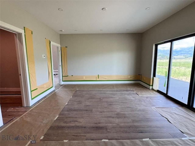 6111 Springhill Rd, Belgrade, MT 59714 - spare room featuring wood finished floors and baseboards