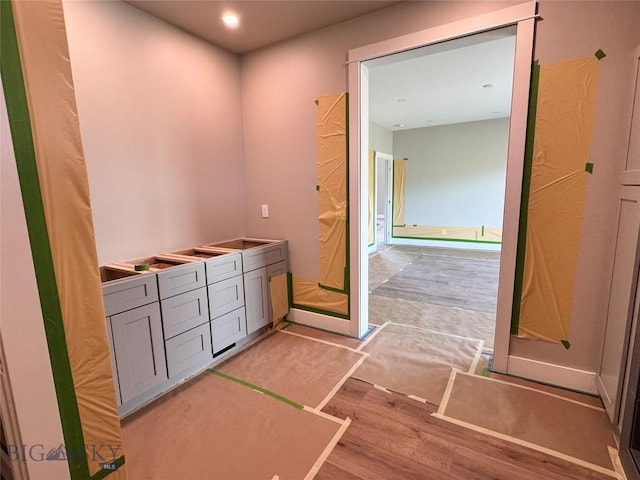 6111 Springhill Rd, Belgrade, MT 59714 - bathroom featuring wood finished floors, vanity, and recessed lighting