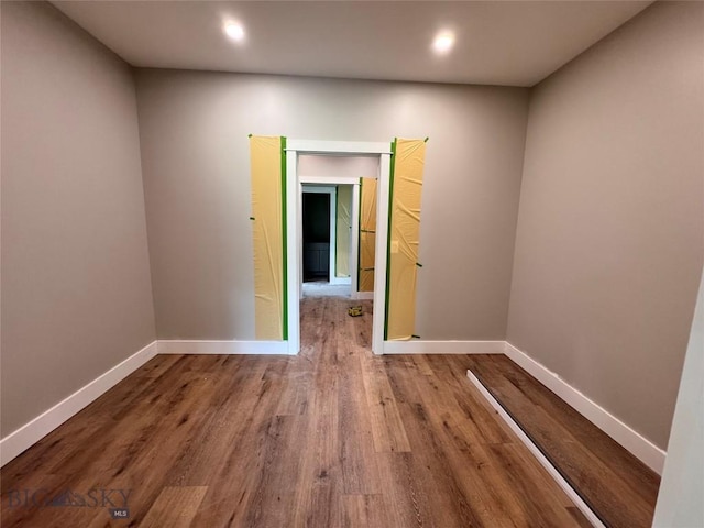 6111 Springhill Rd, Belgrade, MT 59714 - unfurnished room with wood finished floors, baseboards, and recessed lighting