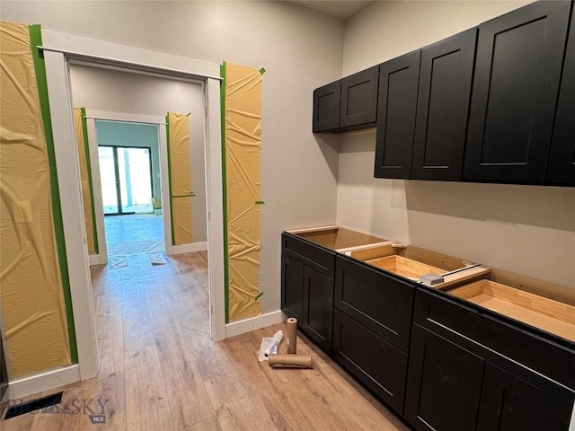 6111 Springhill Rd, Belgrade, MT 59714 - bar with light wood-style flooring and baseboards