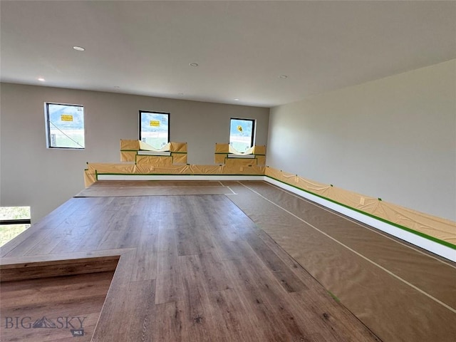 6111 Springhill Rd, Belgrade, MT 59714 - unfurnished room with wood finished floors, plenty of natural light, and recessed lighting
