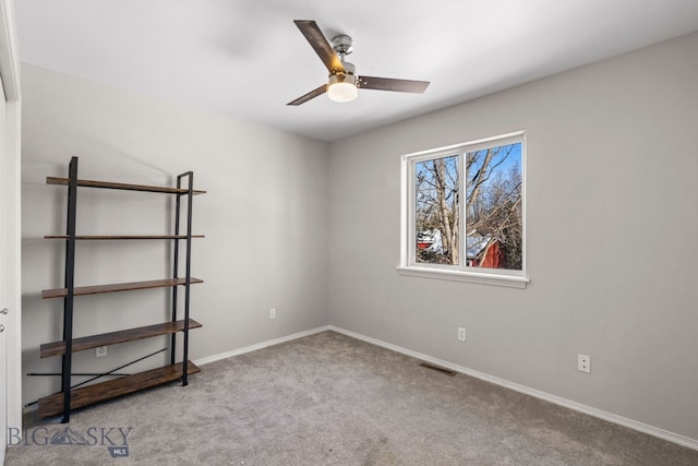 unfurnished room with light carpet and ceiling fan