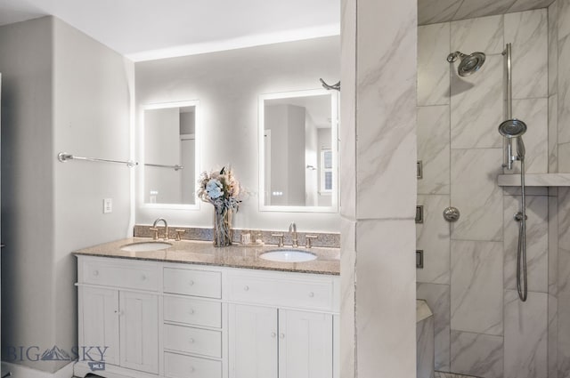 bathroom featuring an enclosed shower and vanity