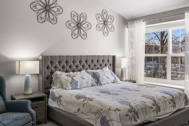 bedroom featuring lofted ceiling