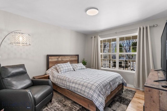 bedroom with wood-type flooring