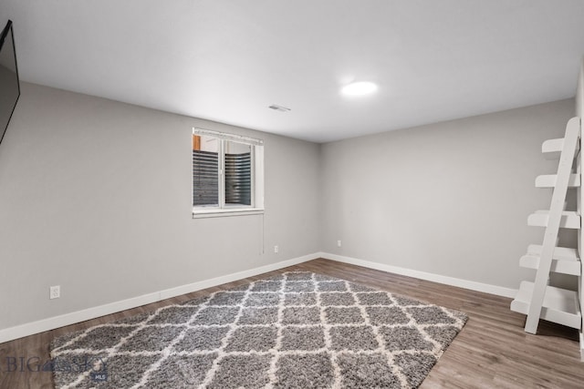 unfurnished room featuring hardwood / wood-style flooring