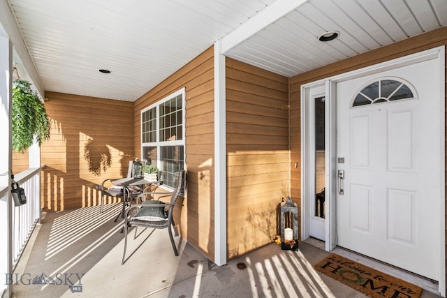 doorway to property featuring covered porch