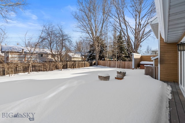 view of yard covered in snow