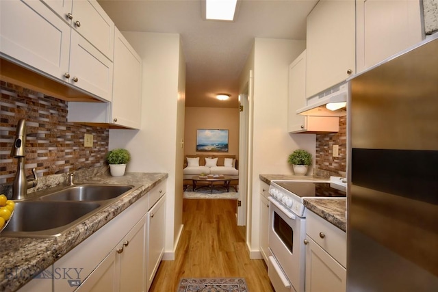 kitchen featuring refrigerator, white cabinetry, sink, white range with electric cooktop, and light wood-type flooring