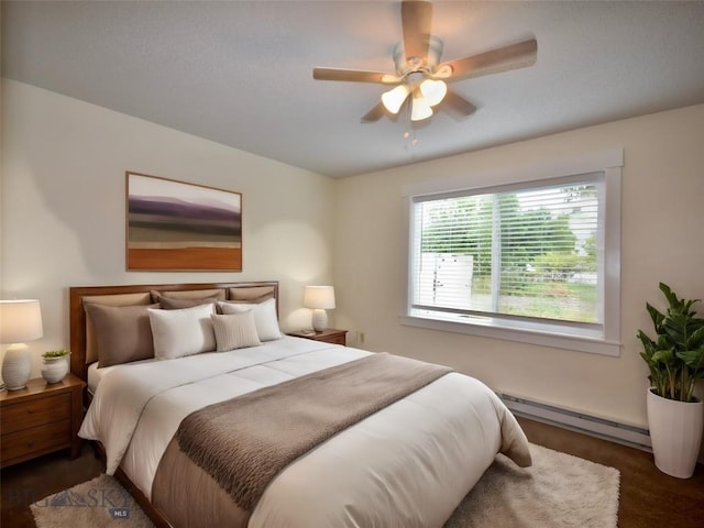 bedroom featuring ceiling fan and a baseboard radiator