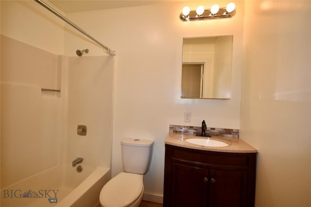 full bathroom featuring bathtub / shower combination, vanity, and toilet