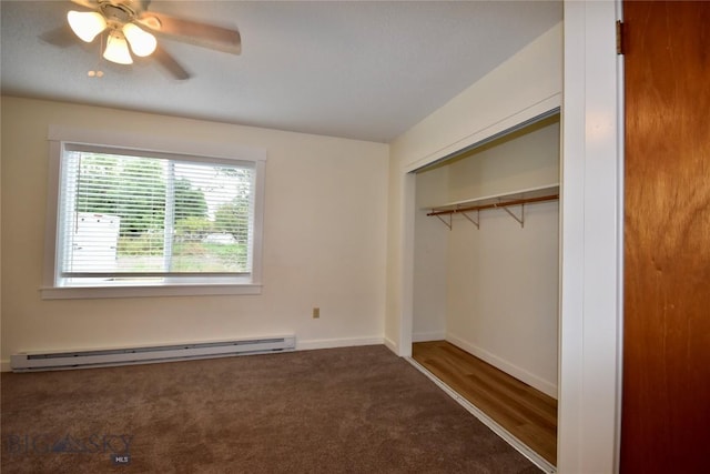 unfurnished bedroom with ceiling fan, a baseboard radiator, a closet, and dark colored carpet