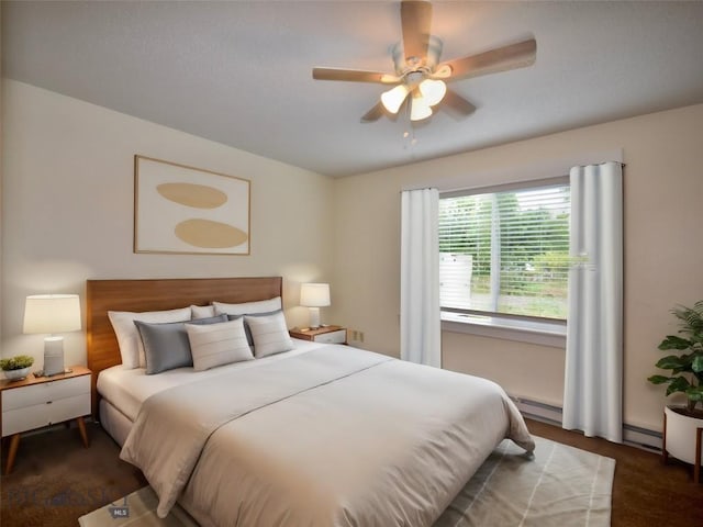 bedroom featuring ceiling fan and a baseboard heating unit