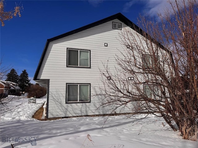 view of snow covered property