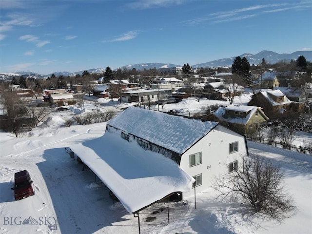 snowy aerial view with a mountain view