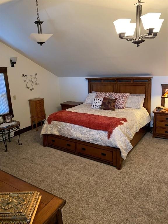 bedroom with an inviting chandelier, carpet flooring, and vaulted ceiling