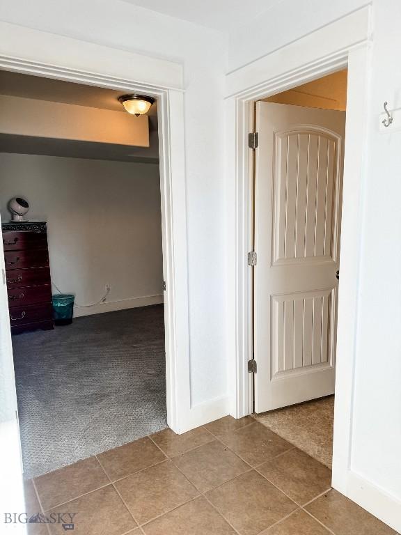 corridor featuring carpet floors