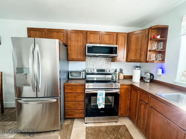 kitchen featuring stainless steel appliances and sink