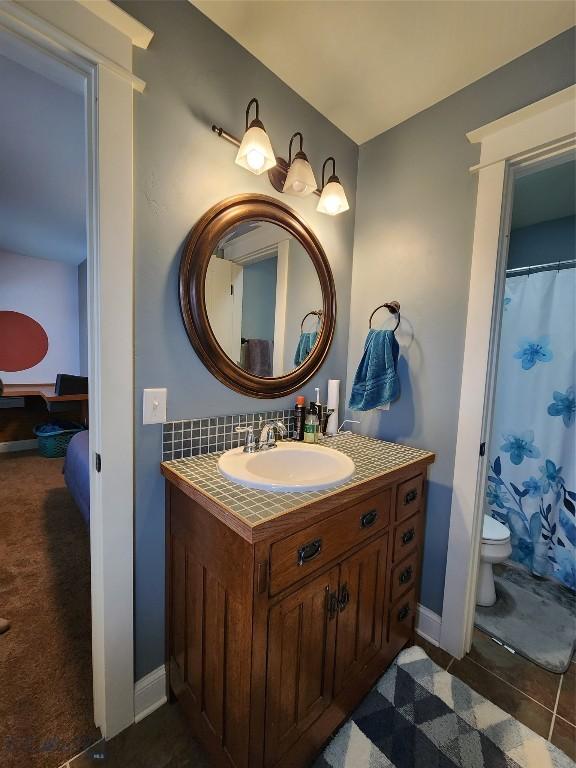 bathroom with vanity and toilet